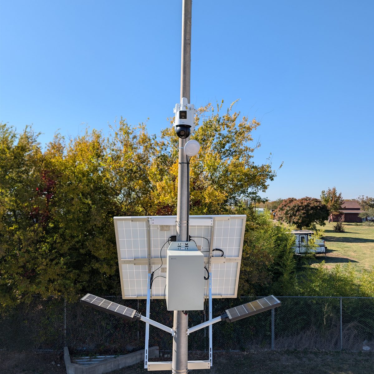 Pole-mounted solar-powered security camera